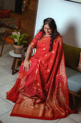 Dola Silk Red Bandhani Saree with Golden Zari Banarasi Pallu and Patola Daaman