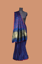 Gaji silk blue and red dotted bandhani saree with golden lagdi patta