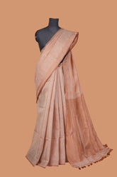 Peach tissue saree with golden zari patta