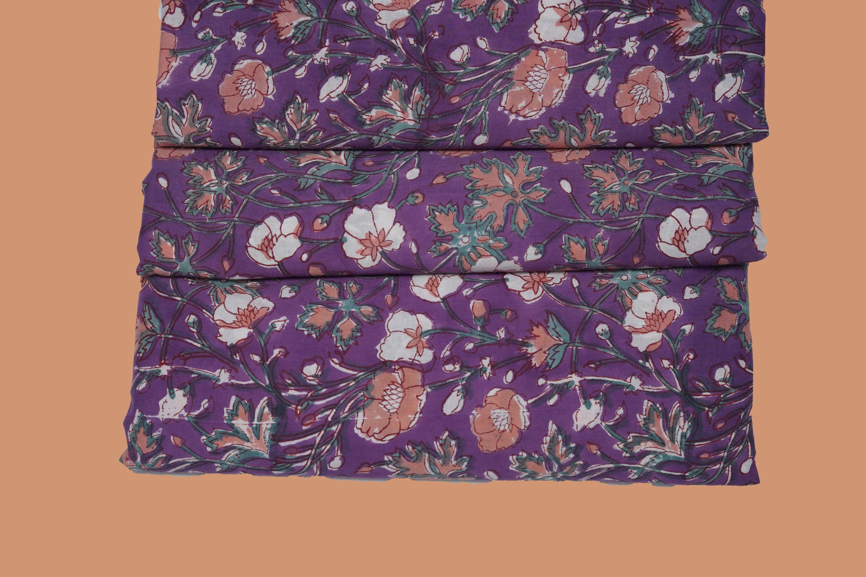 Purple pure cotton Jaipuri fabric with beautiful white and peach floral block print design.