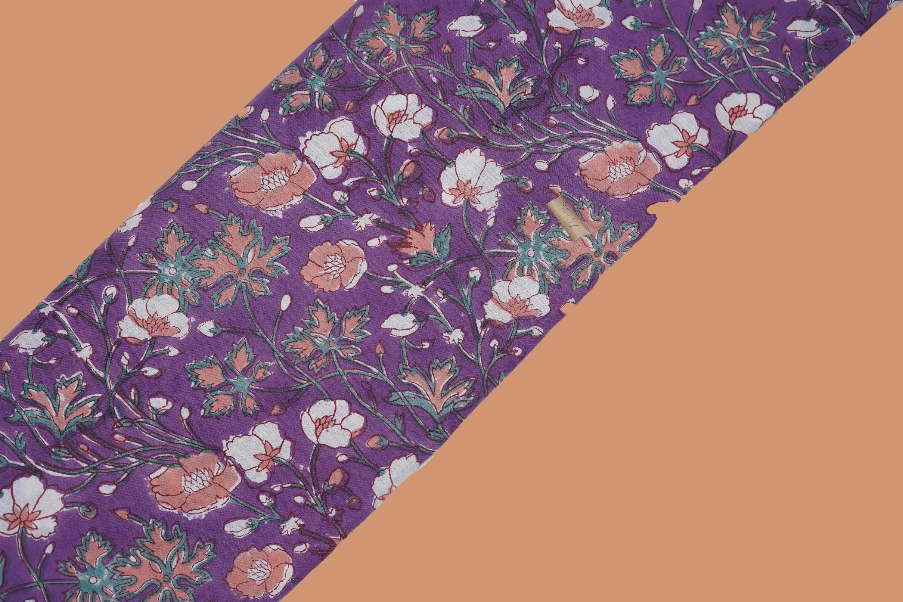 Purple pure cotton Jaipuri fabric with beautiful white and peach floral block print design.